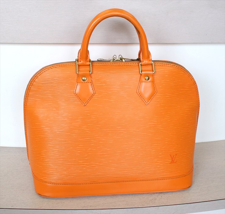 Sold at Auction: Louis Vuitton, Louis Vuitton Mandarin Orange Epi Pont Neuf  PM