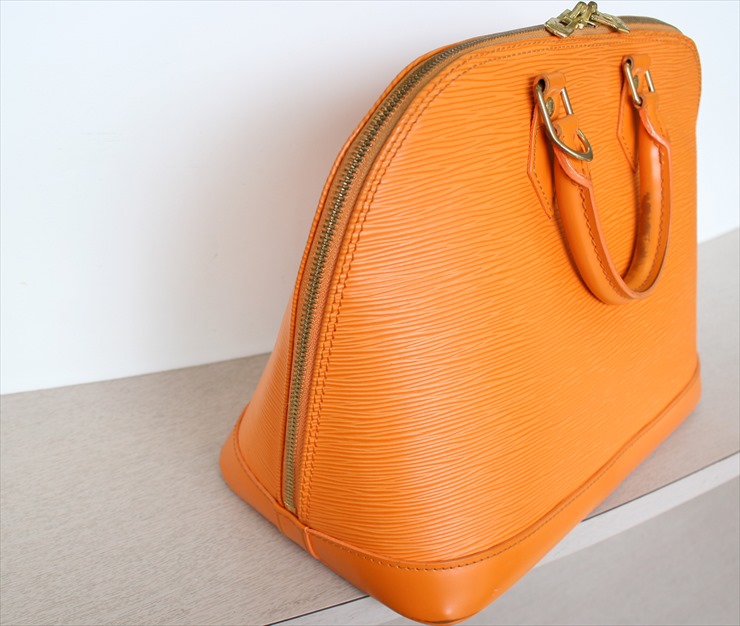 Alma bb leather crossbody bag Louis Vuitton Orange in Leather  14635210