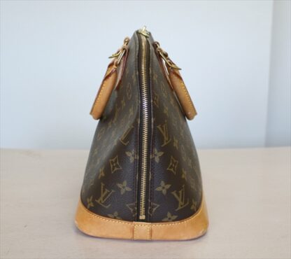 LOUIS VUITTON ALMA Monogram Handbag